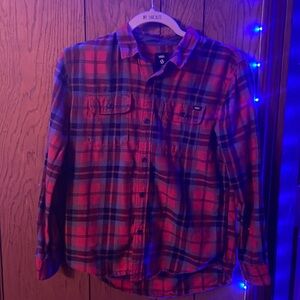 A youth sized button up Vans flannel